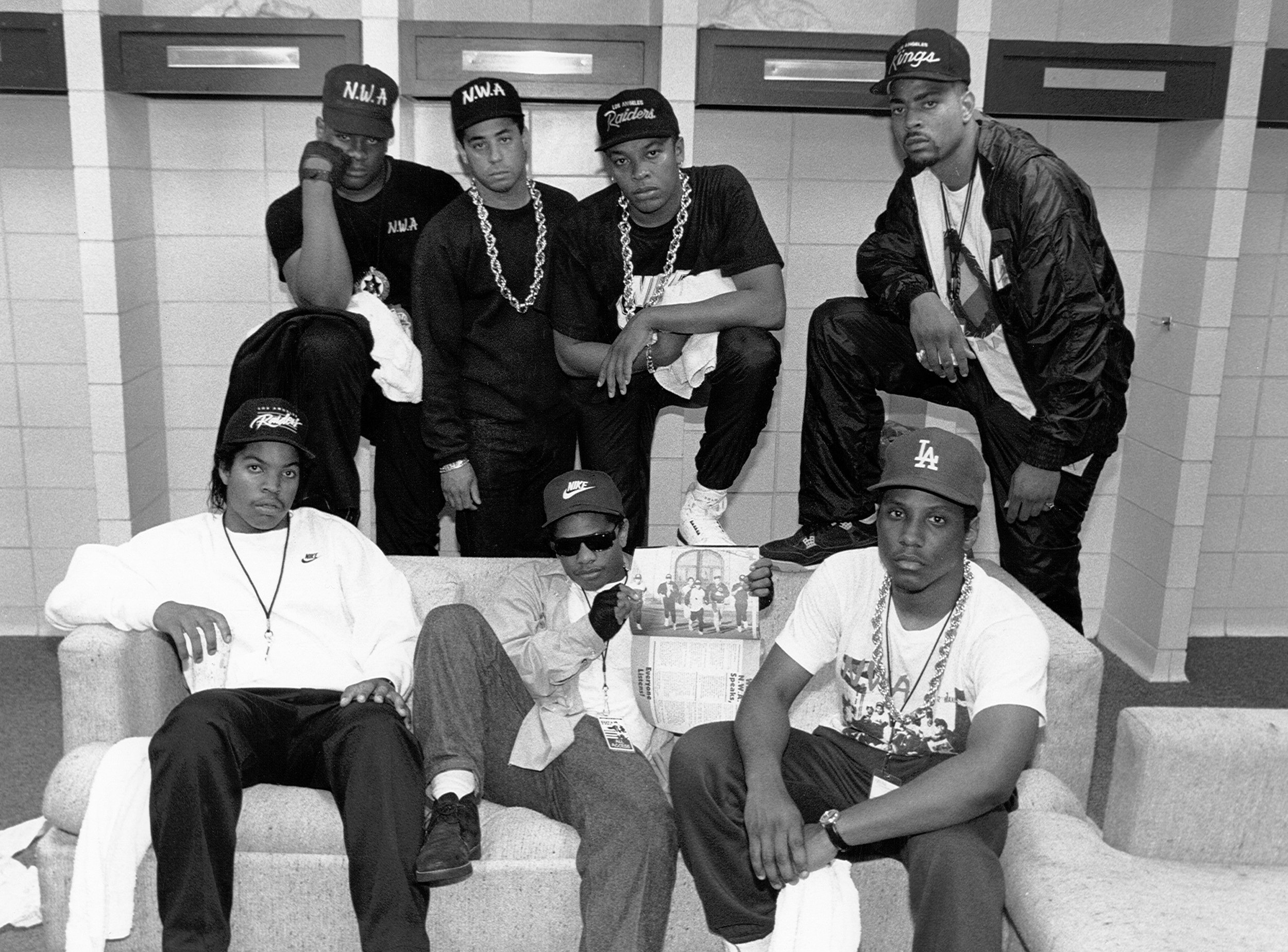 NWA, with the D.O.C. and Above the Law’s Laylaw, backstage at the Kemper Arena during their Straight Outta Compton tour, June 1989, Kansas City, Missouri. (left to right, standing: Laylaw, DJ Yella, Dr. Dre, and the D.O.C.; sitting: Ice Cube, Eazy-E, and MC Ren). Photo by Raymond Boyd/Michael Ochs Archives/Getty Images.